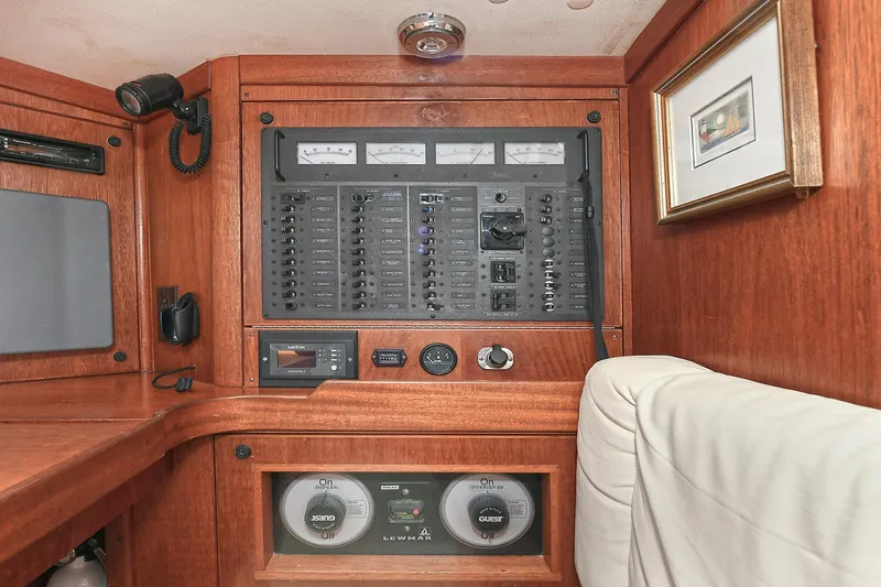 The Verdict III Yacht Photos Pics Control panel of a 2002 Sabre 452 yacht with wooden interior.