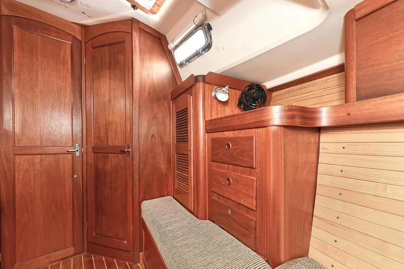 The Verdict III Yacht Photos Pics Interior of 2002 Sabre 452 yacht with wooden cabinetry and seating.