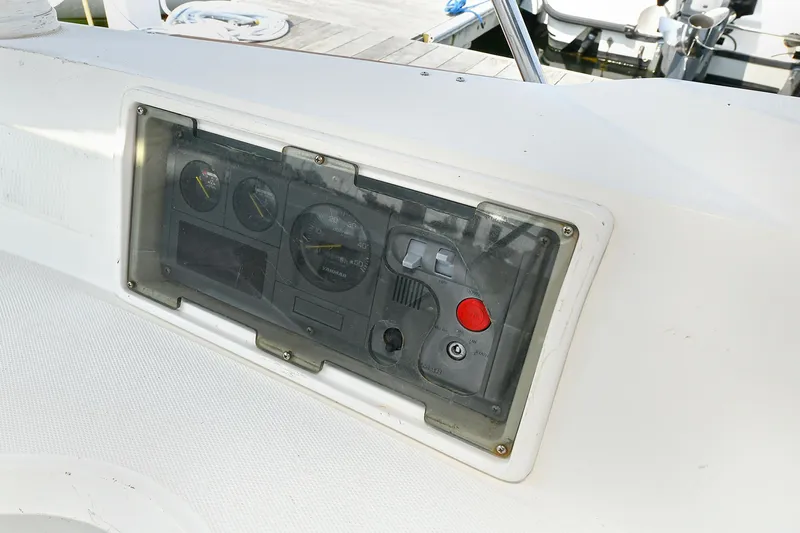 The Verdict III Yacht Photos Pics Control panel of a 2002 Sabre 452 boat with gauges and buttons.