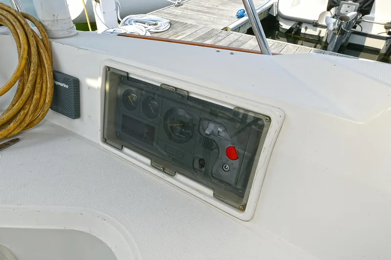 The Verdict III Yacht Photos Pics Control panel on a 2002 Sabre 452 yacht, docked with coiled rope nearby.