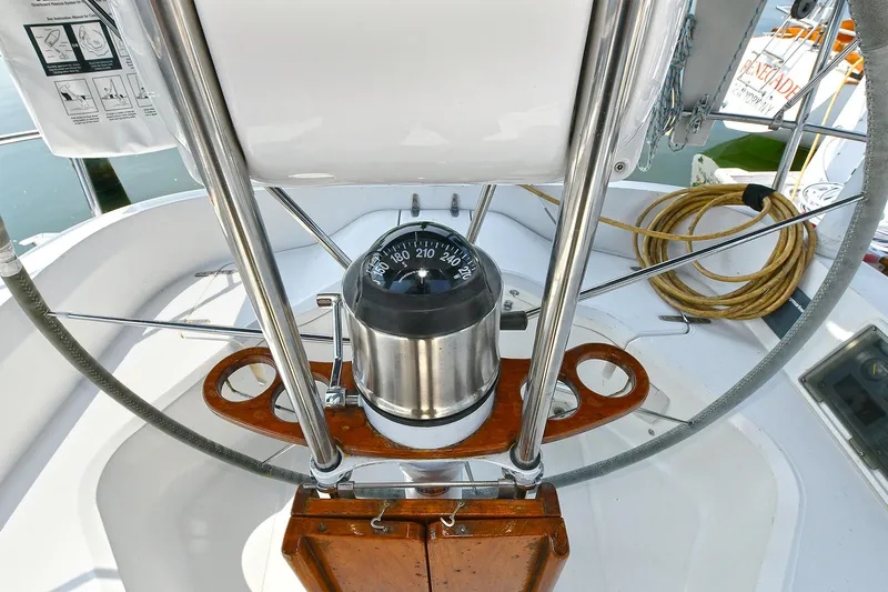 The Verdict III Yacht Photos Pics Compass on 2002 Sabre 452 yacht, featuring a sleek navigation setup.