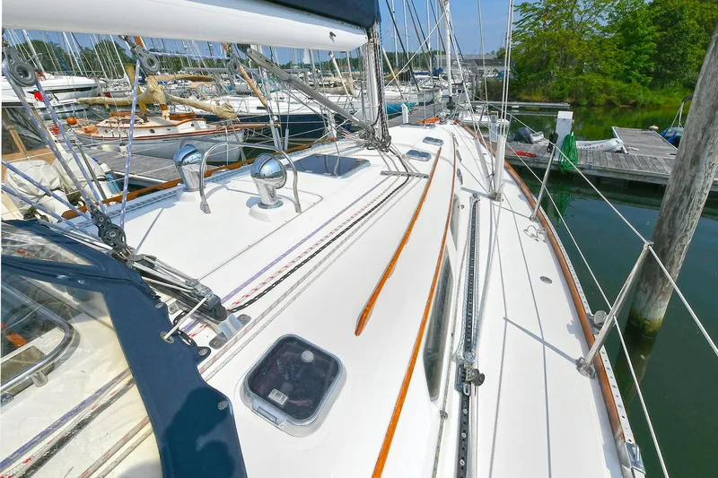 The Verdict III Yacht Photos Pics 2002 Sabre 452 sailboat deck view at marina, showcasing sleek design and rigging.