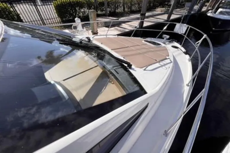  Yacht Photos Pics 2016 Sea Ray 400 Sundancer yacht docked, featuring sleek design and spacious deck.