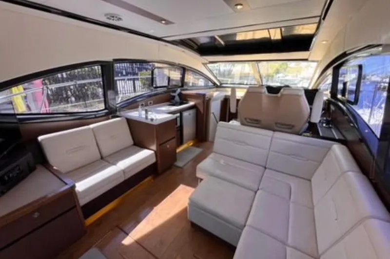  Yacht Photos Pics Luxurious interior of 2016 Sea Ray 400 Sundancer yacht with modern seating and sleek design.