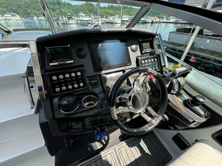  Yacht Photos Pics Cockpit of 2019 Monterey 335 SY boat with modern controls and steering wheel.