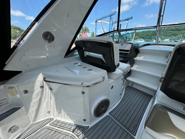  Yacht Photos Pics 2019 Monterey 335 SY boat interior with seating and modern dashboard.