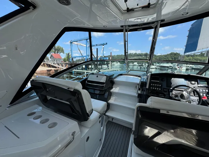  Yacht Photos Pics 2019 Monterey 335 SY boat interior with modern dashboard and seating.