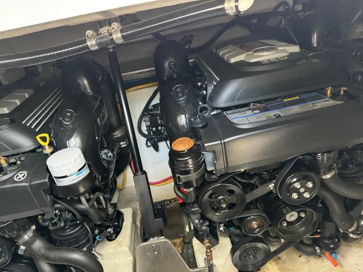  Yacht Photos Pics Engine compartment of a 2019 Monterey 335 SY boat, showcasing dual engines and components.