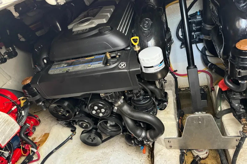  Yacht Photos Pics Engine compartment of a 2019 Monterey 335 SY boat, showcasing mechanical components.
