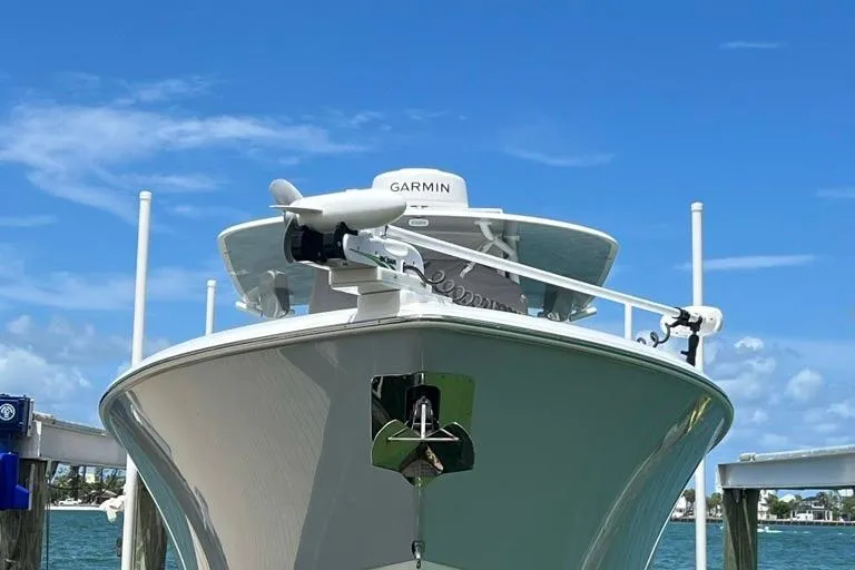  Yacht Photos Pics 2023 Contender 39 ST boat with Garmin equipment, docked under a clear blue sky.