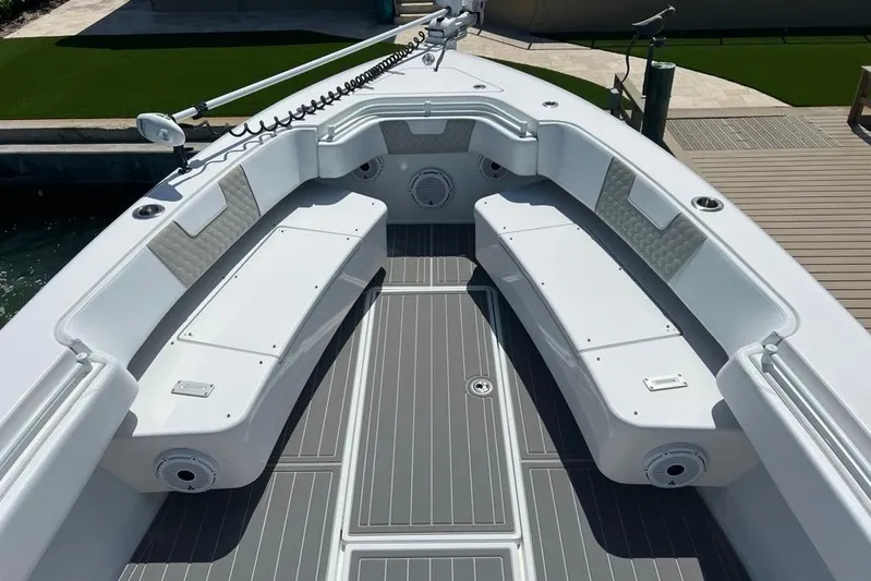  Yacht Photos Pics 2023 Contender 39 ST boat interior with cushioned seating and sleek design.