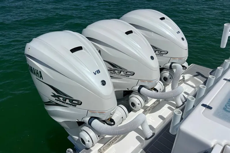  Yacht Photos Pics Triple Yamaha XTO V8 engines on 2023 Contender 39 ST boat in water.