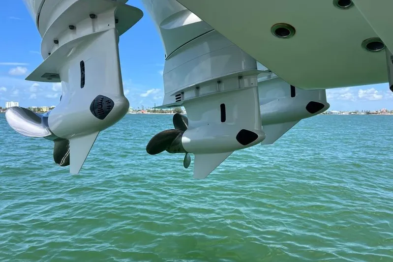  Yacht Photos Pics 2023 Contender 39 ST boat engines over clear blue water.