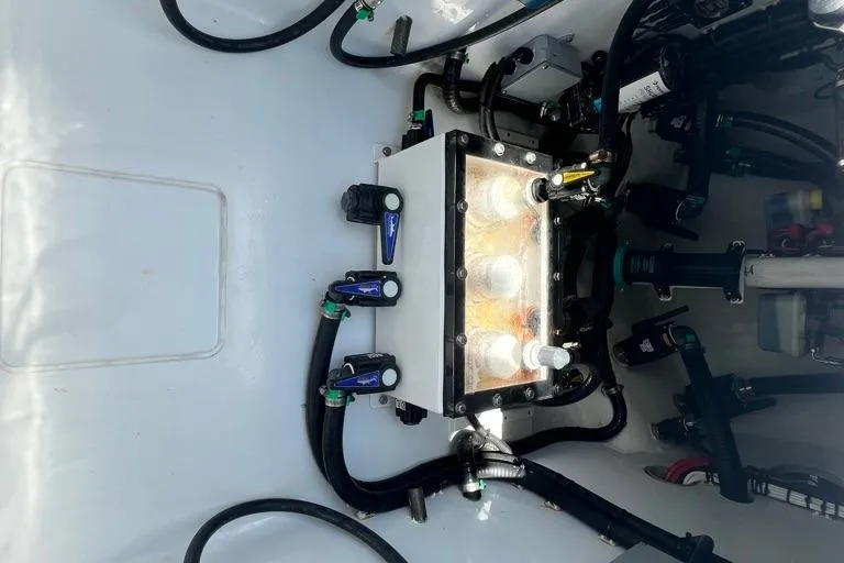  Yacht Photos Pics Engine compartment of a 2023 Contender 39 ST boat, showcasing wiring and components.