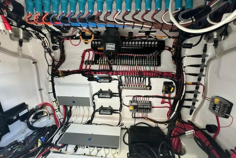  Yacht Photos Pics Electrical wiring system inside a 2023 Contender 39 ST boat, showcasing organized cables and components.