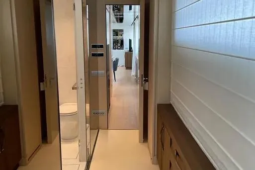  Yacht Photos Pics Interior hallway of 2019 Sanlorenzo SL106 yacht, featuring modern design and wood accents.