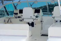2011 Cabo Express 40 yacht cockpit with white seating and navigation equipment.