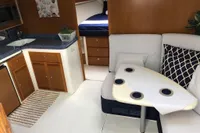 Interior of 2011 Cabo Express 40 yacht with kitchenette and seating area.