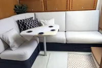 Interior of 2011 Cabo Express 40 yacht with white seating and modern decor.