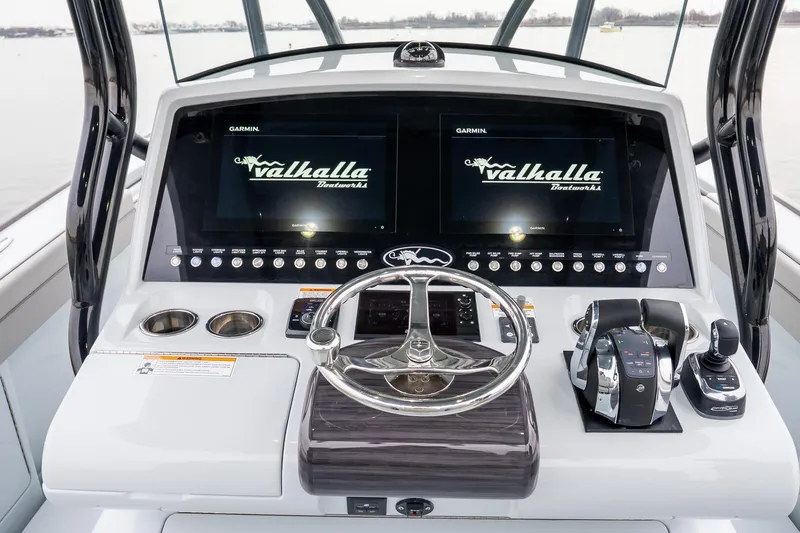 Yacht Photos Pics 2023 Valhalla Boatworks V-33 helm with dual Garmin displays and modern controls.
