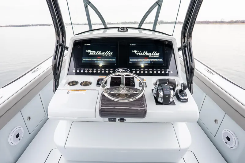  Yacht Photos Pics 2023 Valhalla Boatworks V-33 helm with dual displays and modern controls.