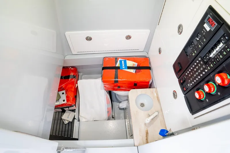  Yacht Photos Pics 2023 Valhalla V-33 boat interior with safety gear and control panel.