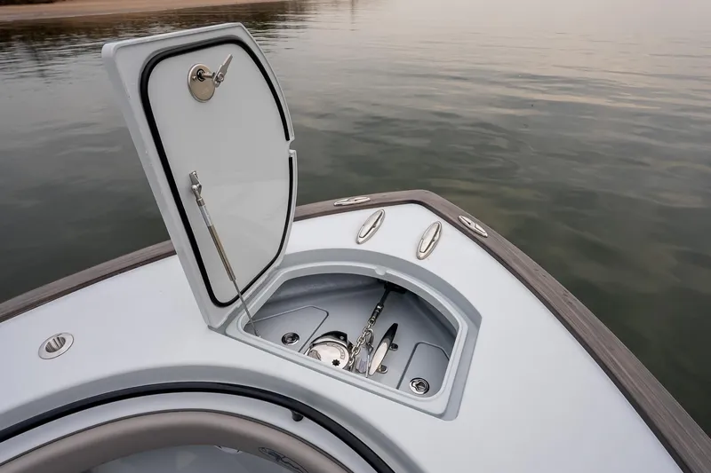  Yacht Photos Pics 2023 Valhalla Boatworks V-33 anchor compartment open on calm water.