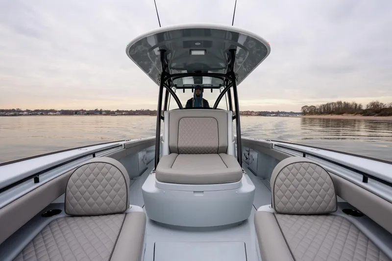  Yacht Photos Pics 2023 Valhalla Boatworks V-33 with luxurious seating on calm waters.