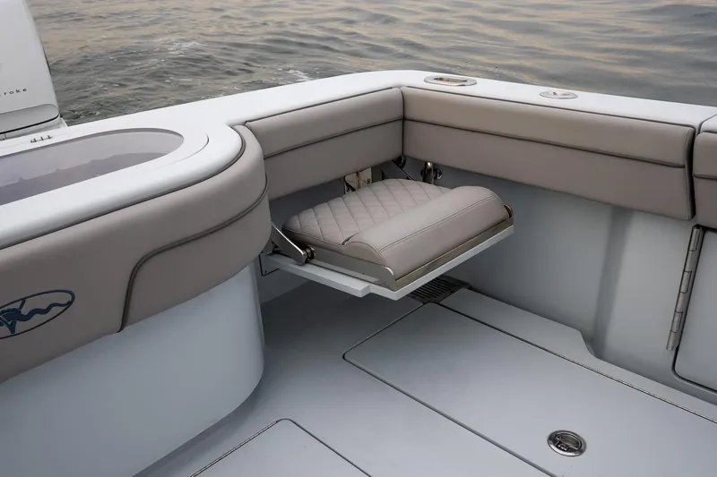  Yacht Photos Pics 2023 Valhalla Boatworks V-33 interior with foldable seat and sleek design.