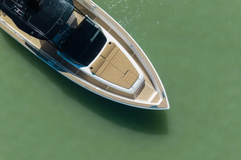 Scouser Yacht Photos Pics Aerial view of 2025 Pardo Yachts P38R luxury yacht on calm green water.