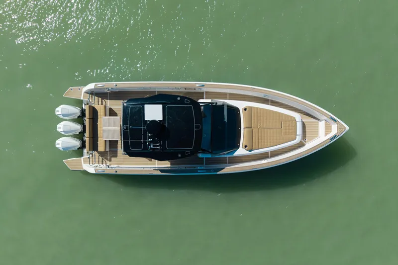 Scouser Yacht Photos Pics Top view of 2025 Pardo Yachts P38R luxury boat on green water.