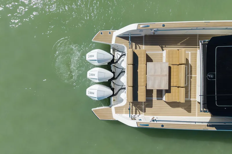 Scouser Yacht Photos Pics Top view of 2025 Pardo Yachts P38R with triple outboard engines and elegant deck seating.