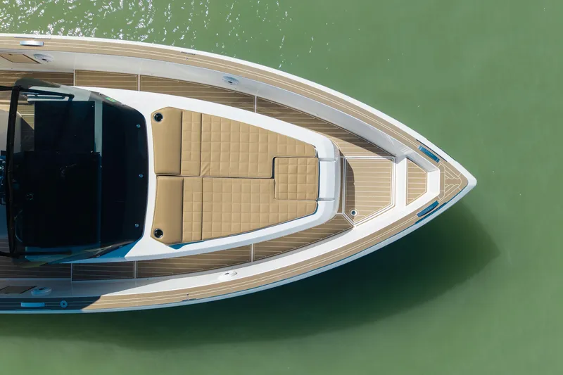 Scouser Yacht Photos Pics Top view of 2025 Pardo Yachts P38R luxury boat on green water.