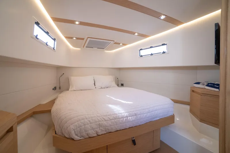 Scouser Yacht Photos Pics Luxurious cabin interior of 2025 Pardo Yachts P38R with modern design and cozy bedding.