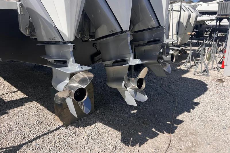 Scouser Yacht Photos Pics 2025 Pardo Yachts P38R outboard motors with propellers on gravel surface.