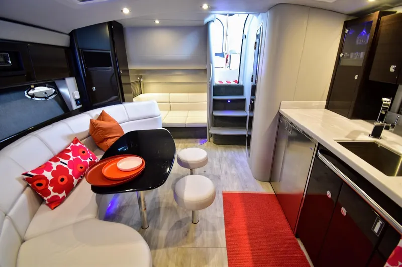 Nauti Dog II Yacht Photos Pics Luxurious interior of 2021 Formula 40 PC yacht with modern kitchen and seating area.