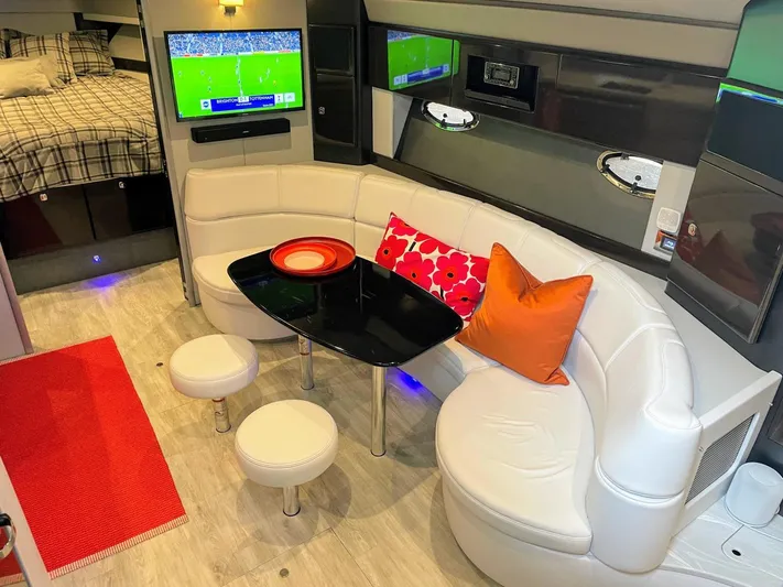 Nauti Dog II Yacht Photos Pics Luxurious interior of a 2021 Formula 40 PC yacht with modern seating and entertainment system.