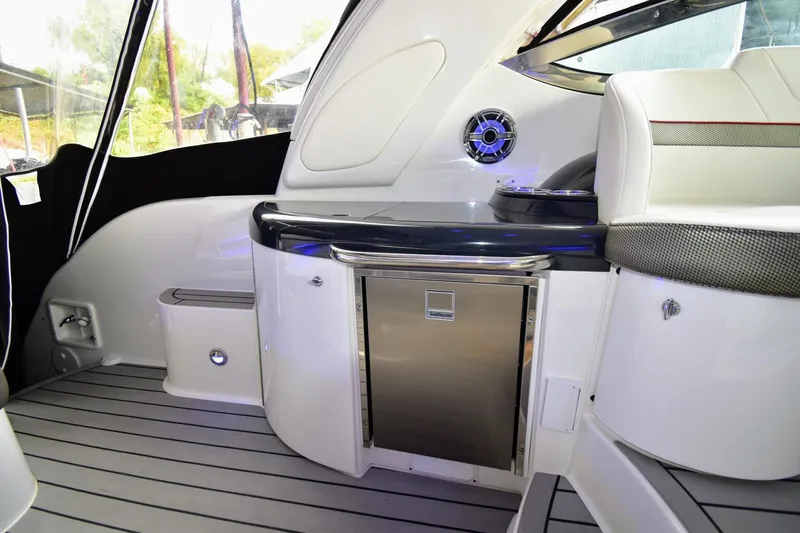 Nauti Dog II Yacht Photos Pics 2021 Formula 40 PC yacht interior with mini fridge and seating area.