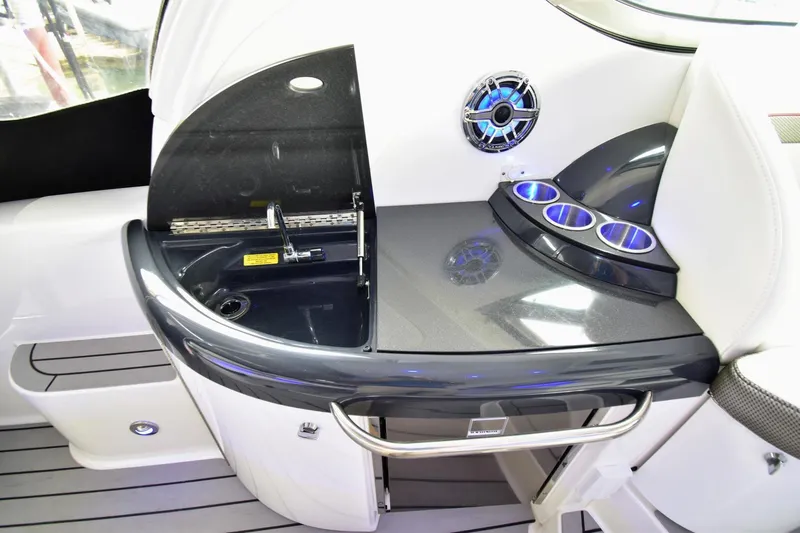 Nauti Dog II Yacht Photos Pics 2021 Formula 40 PC yacht interior with sink, cup holders, and sleek design.