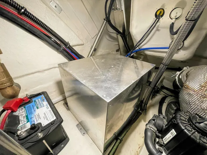 Nauti Dog II Yacht Photos Pics Engine compartment of a 2021 Formula 40 PC boat with battery and metal box.