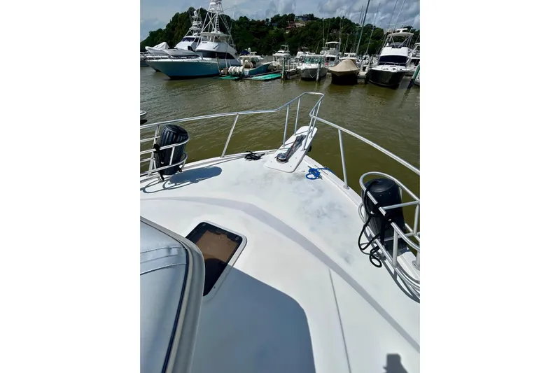  Yacht Photos Pics Bow view of 1990 Viking 48 Convertible yacht docked at marina.