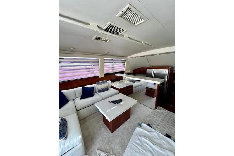  Yacht Photos Pics Luxurious interior of 1990 Viking 48 Convertible yacht with modern furnishings and kitchen.