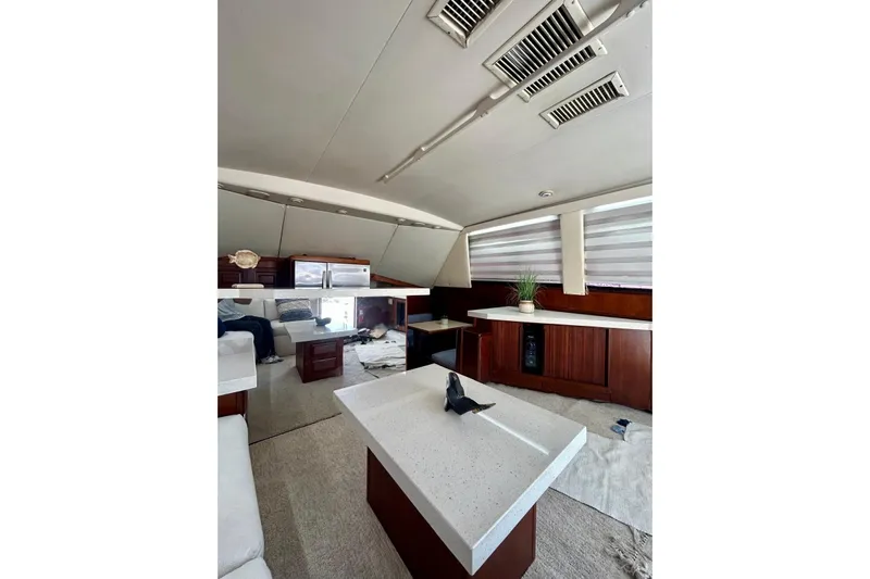  Yacht Photos Pics Luxurious interior of 1990 Viking 48 Convertible yacht with modern furnishings and decor.