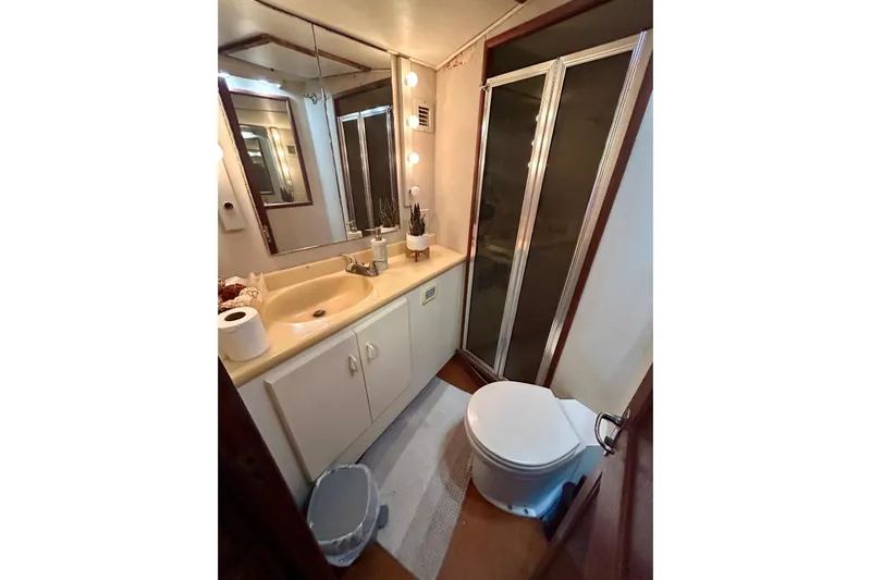  Yacht Photos Pics Bathroom interior of 1990 Viking 48 Convertible yacht with shower and vanity.