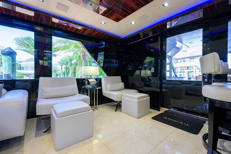  Yacht Photos Pics Luxurious interior of 1997 Broward 108 Raised Pilothouse yacht with modern seating and large windows.