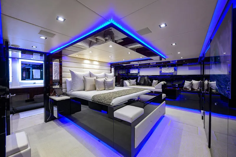  Yacht Photos Pics Luxurious master bedroom on a 1997 Broward 108 Raised Pilothouse yacht with modern LED lighting.