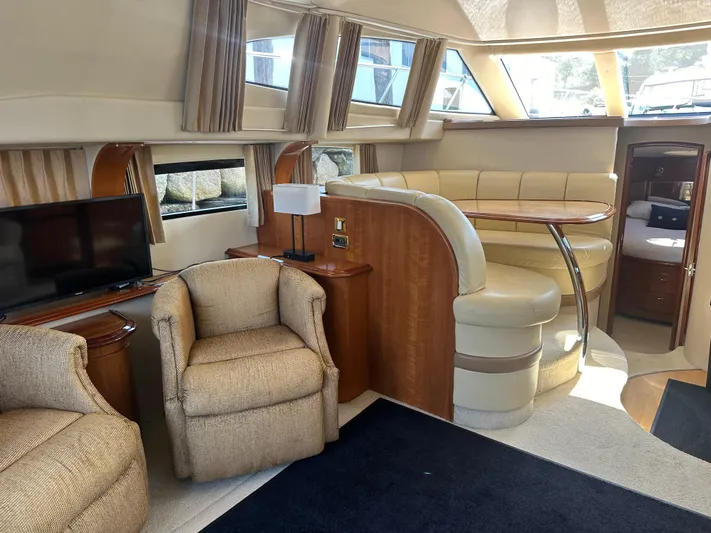  Yacht Photos Pics Luxurious interior of 2004 Carver 420 Mariner yacht with plush seating and modern amenities.