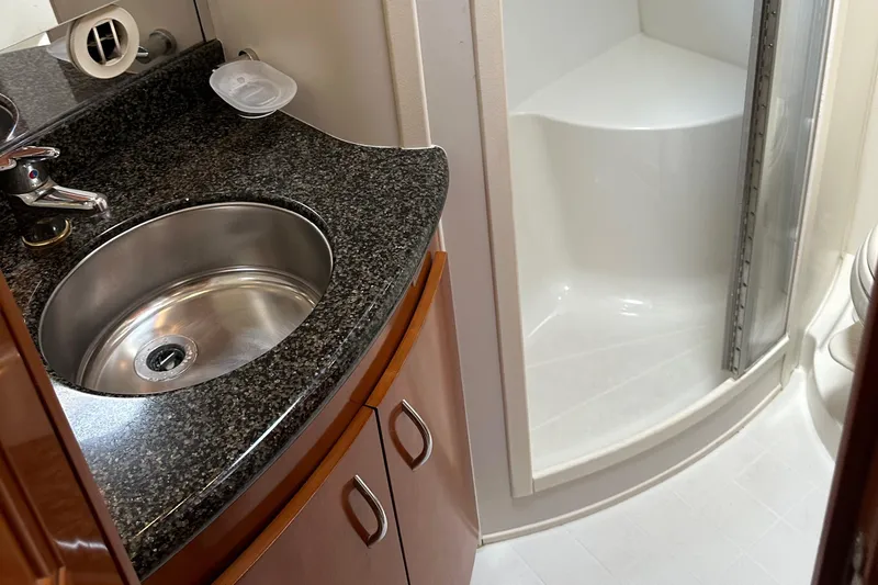  Yacht Photos Pics 2004 Carver 420 Mariner bathroom with granite countertop and shower.