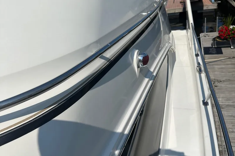  Yacht Photos Pics 2004 Carver 420 Mariner yacht side view with sleek design and chrome details.