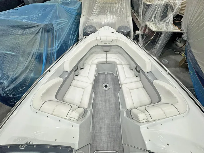  Yacht Photos Pics 2013 Formula 290 Bowrider boat interior with white seating and gray flooring.